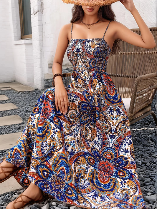 Long printed dress with straps and fitted waist.