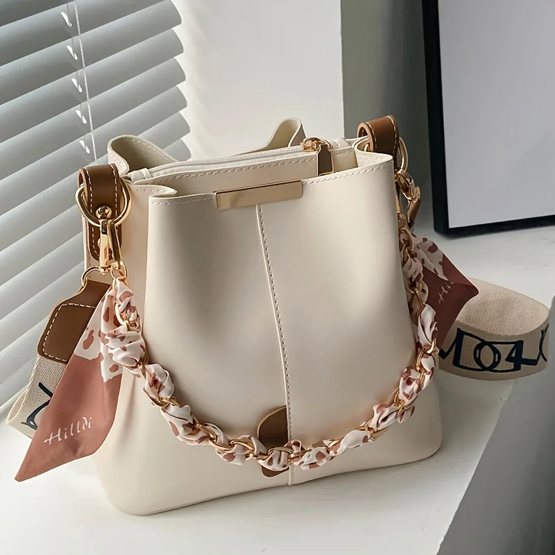 Bolsa Bucket Ribbon Chain – Elegância Feminina com Espaço e Versatilidade